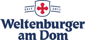Das farbige Logo des Weltenburger am Dom mit seinem traditionellen Kreuz.