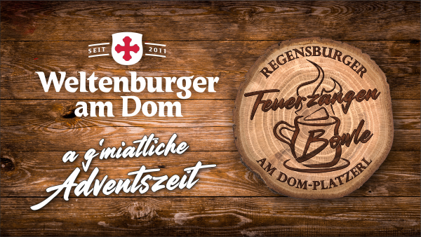 Flyer der Regensburger Feuerzangenbowle am Dom-Platzerl zeigt einen Baumstamm mit dem eingravierten Schriftzug „Feuerzangenbowle"