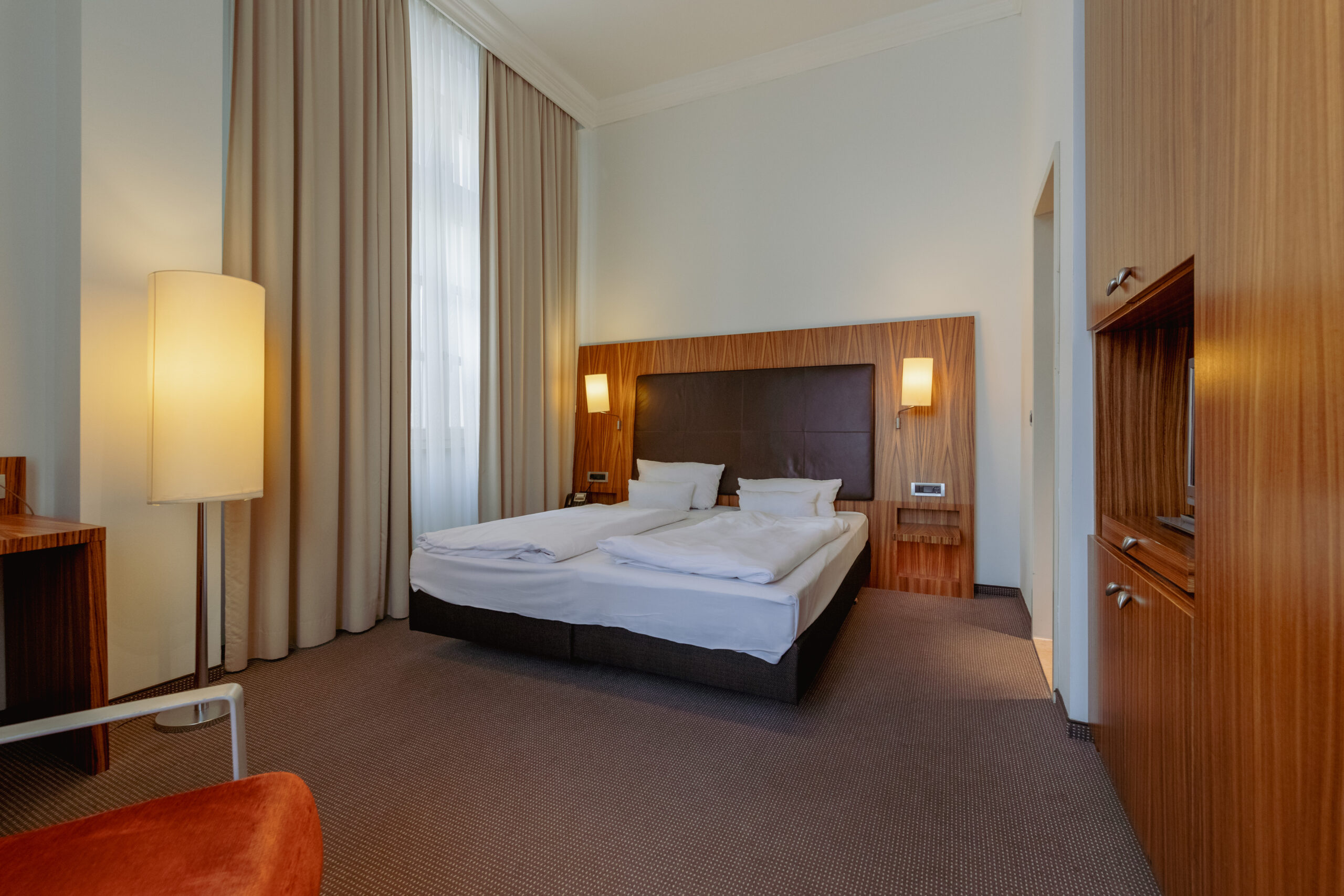Das komfortable Bett im Doppelzimmer M im Herzogshof Boutique-Hotel am Dom